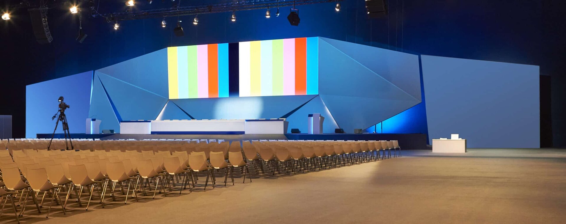 Global Venue Resourcing & Procurement — arena-scale hall staged and seated for show day
